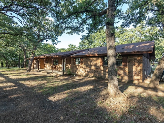 12580 Briar Rd, Azle, TX 76020 - rear view of property featuring brick siding