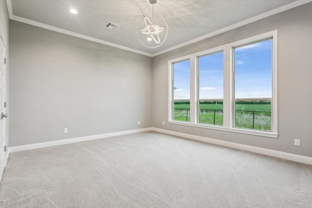 empty room with visible vents, crown molding, baseboards, and carpet floors