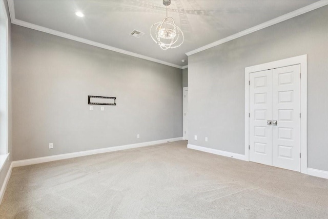 carpeted spare room with visible vents, crown molding, baseboards, an inviting chandelier, and recessed lighting