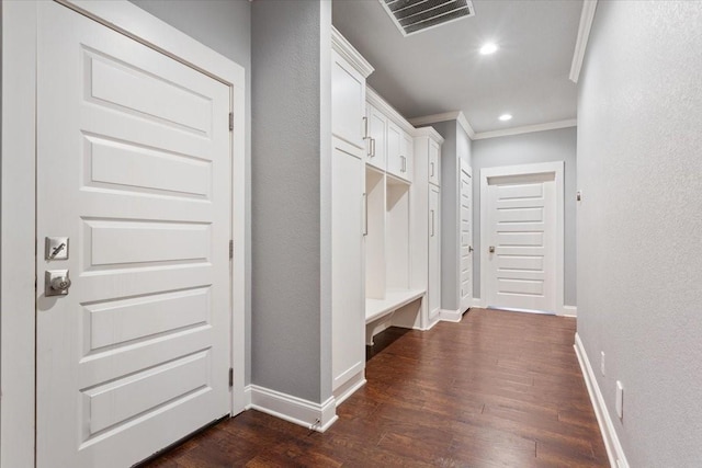 mudroom with baseboards, ornamental molding, dark wood-style floors, and visible vents