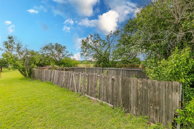 view of yard with fence