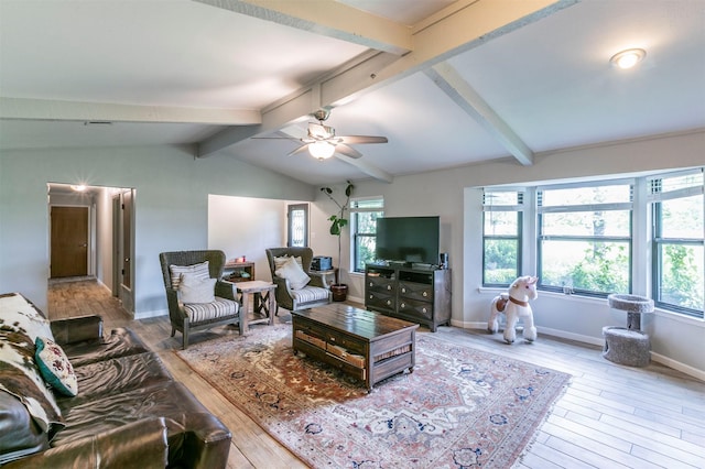 living area featuring baseboards, vaulted ceiling with beams, wood-type flooring, and ceiling fan
