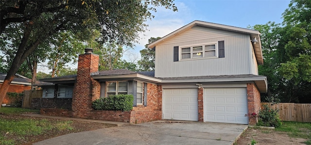 6404 Brentwood Dr, Fort Worth, TX 76112 - view of front facade with fence, an attached garage, a chimney, and brick siding