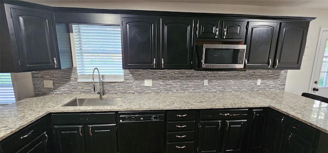 6404 Brentwood Dr, Fort Worth, TX 76112 - kitchen with backsplash, a sink, stainless steel microwave, and dishwasher