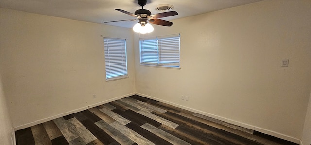 6404 Brentwood Dr, Fort Worth, TX 76112 - unfurnished room with dark wood-type flooring, baseboards, ceiling fan, and visible vents
