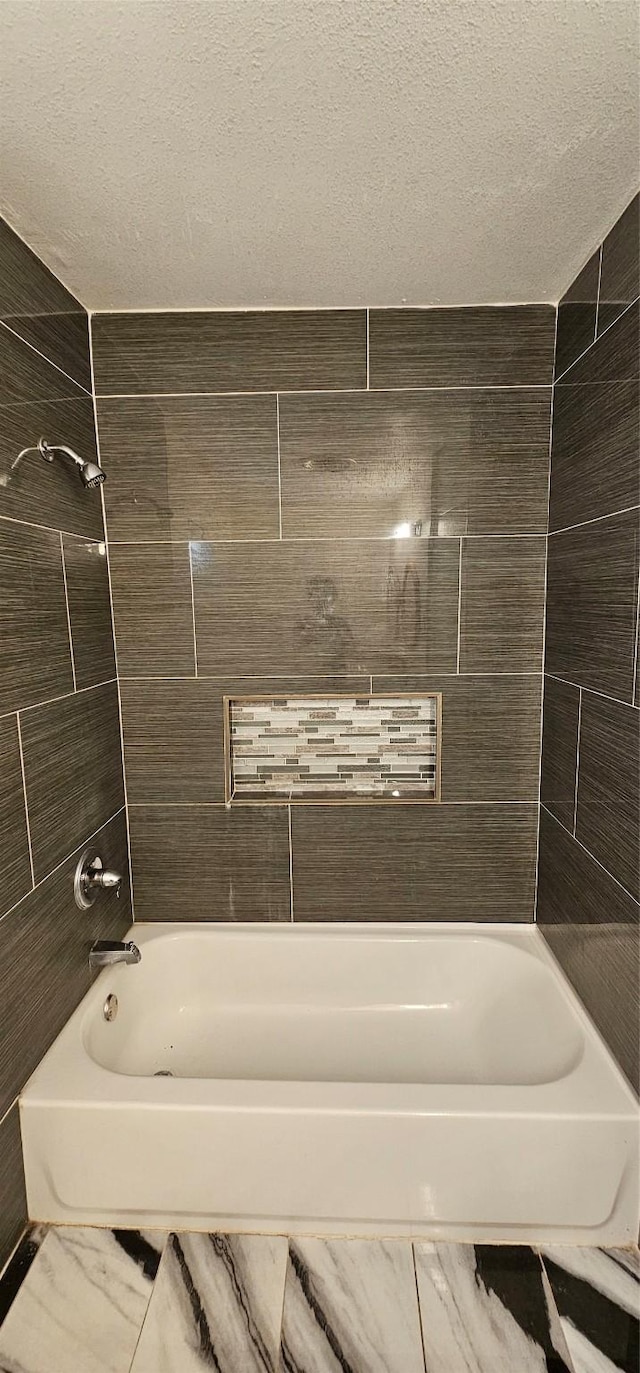 6404 Brentwood Dr, Fort Worth, TX 76112 - full bathroom featuring a textured ceiling and tub / shower combination