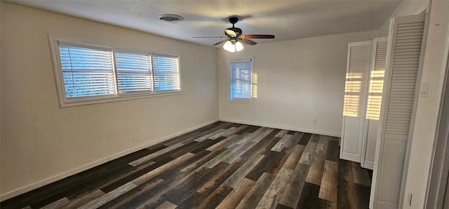 6404 Brentwood Dr, Fort Worth, TX 76112 - unfurnished room featuring baseboards, a ceiling fan, dark wood-type flooring, and visible vents