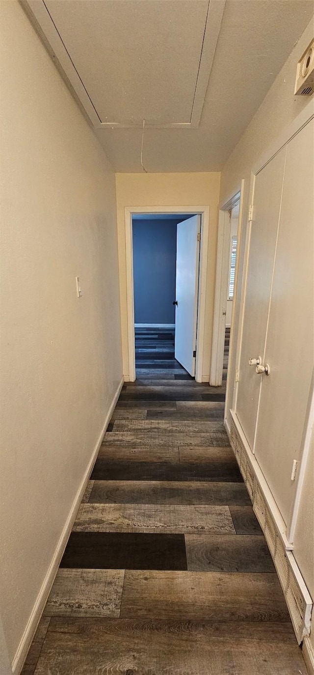 6404 Brentwood Dr, Fort Worth, TX 76112 - hallway featuring baseboards, attic access, and dark wood finished floors