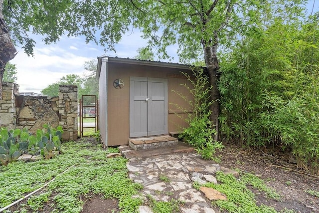 view of shed with a gate