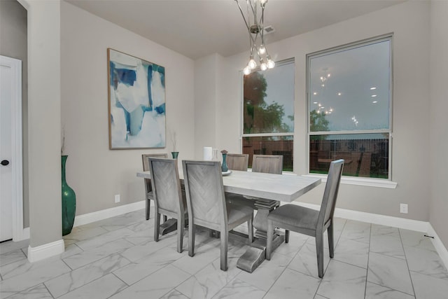 dining room featuring baseboards and marble finish floor