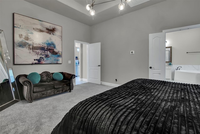 bedroom featuring carpet flooring, ceiling fan, baseboards, and ensuite bath