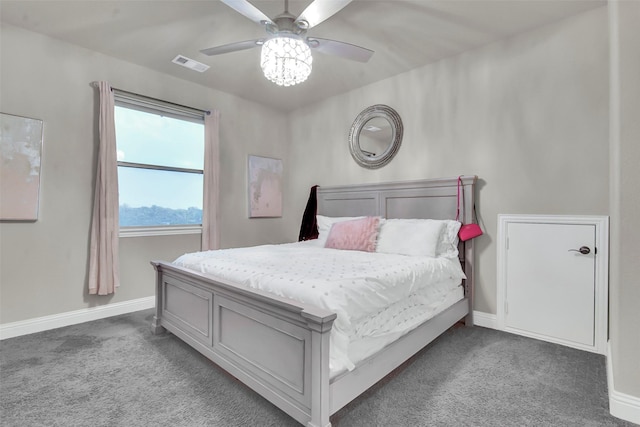 bedroom with visible vents, a ceiling fan, baseboards, and carpet floors