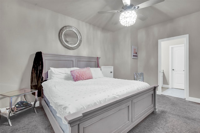 carpeted bedroom featuring baseboards and ceiling fan