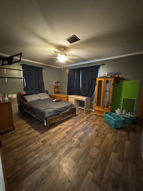 405 E Lee St, Rotan, TX 79546 - bedroom featuring a ceiling fan, visible vents, ornamental molding, and wood finished floors