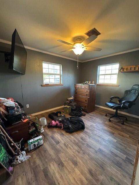 405 E Lee St, Rotan, TX 79546 - bedroom featuring crown molding, wood finished floors, and multiple windows