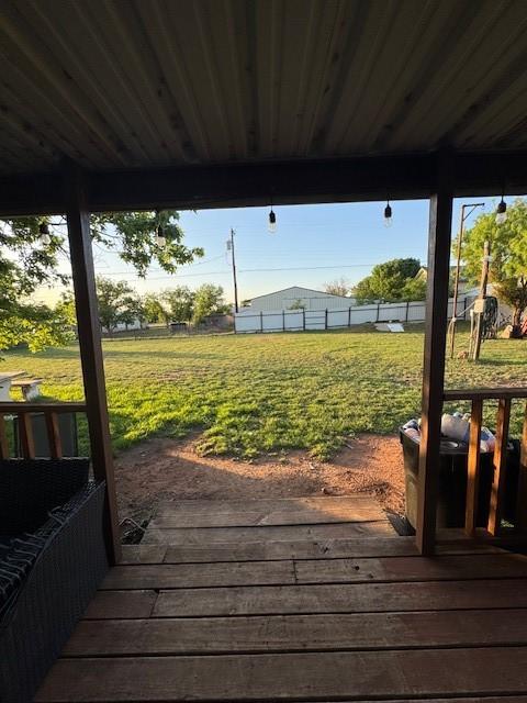 405 E Lee St, Rotan, TX 79546 - deck with a yard and fence