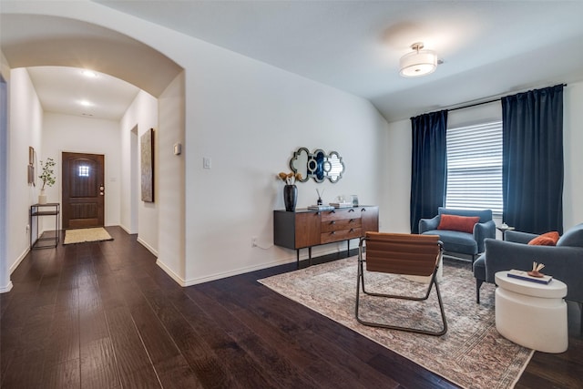 1809 6th St, Argyle, TX 76226 - living room with arched walkways, wood finished floors, baseboards, and vaulted ceiling