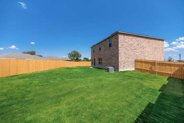 view of yard featuring a fenced backyard and cooling unit