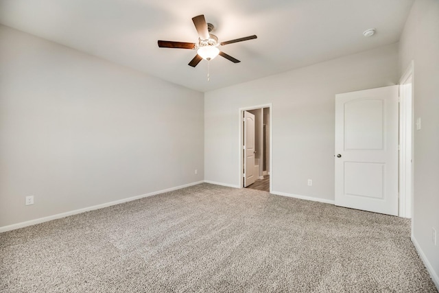 unfurnished bedroom featuring carpet flooring, a ceiling fan, and baseboards