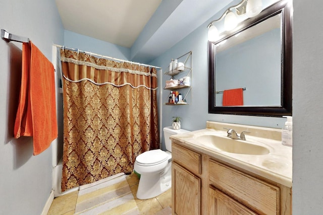 bathroom with tile patterned flooring, toilet, and vanity