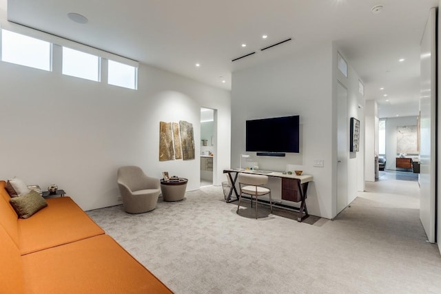 carpeted living room with recessed lighting and a healthy amount of sunlight