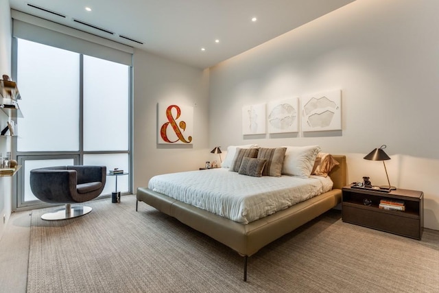 carpeted bedroom with recessed lighting