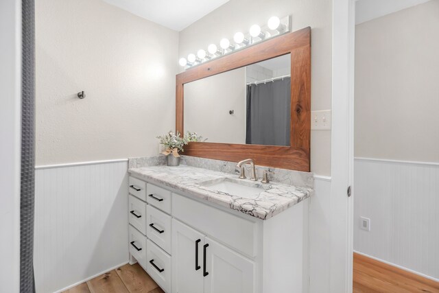 397 Rs County Road 4452, Point, TX 75472 - bathroom featuring wainscoting, vanity, and wood finished floors