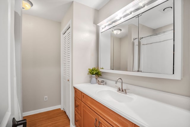 397 Rs County Road 4452, Point, TX 75472 - full bath with vanity, wood finished floors, and baseboards
