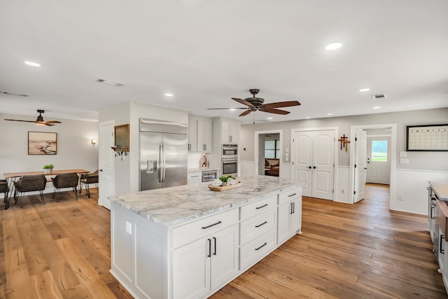 397 Rs County Road 4452, Point, TX 75472 - kitchen with stainless steel appliances, a ceiling fan, white cabinetry, a center island, and recessed lighting