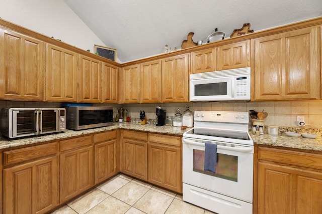 8121 Kathleen Dr, Fort Worth, TX 76137 - kitchen featuring lofted ceiling, a toaster, white appliances, tasteful backsplash, and light tile patterned floors