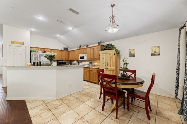 8121 Kathleen Dr, Fort Worth, TX 76137 - dining area featuring visible vents, recessed lighting, light tile patterned flooring, and lofted ceiling