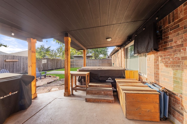 8121 Kathleen Dr, Fort Worth, TX 76137 - view of patio with a fenced backyard and a jacuzzi
