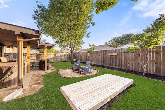 8121 Kathleen Dr, Fort Worth, TX 76137 - view of yard with a fenced backyard, ceiling fan, a wooden deck, and a patio area