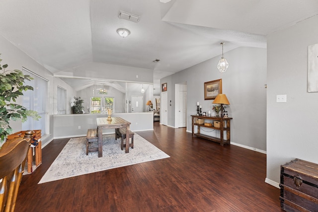 8121 Kathleen Dr, Fort Worth, TX 76137 - dining room featuring an inviting chandelier, wood finished floors, visible vents, baseboards, and lofted ceiling
