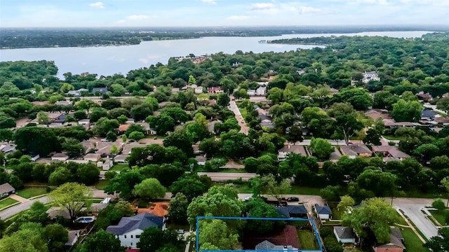drone / aerial view featuring a water view and a residential view