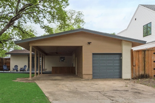 view of front facade featuring concrete driveway, fence, and a ceiling fan