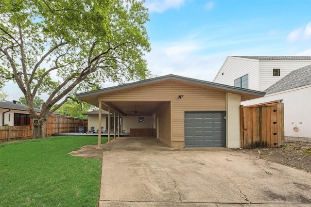 view of front of home featuring a garage, fence, a front yard, a ceiling fan, and concrete driveway