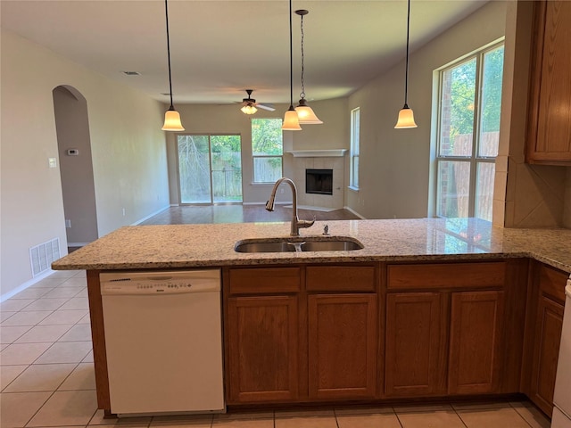 406 Fisherman Trl, Melissa, TX 75454 - kitchen with ceiling fan, a sink, dishwasher, arched walkways, and a wealth of natural light