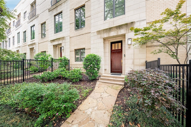 property entrance featuring fence
