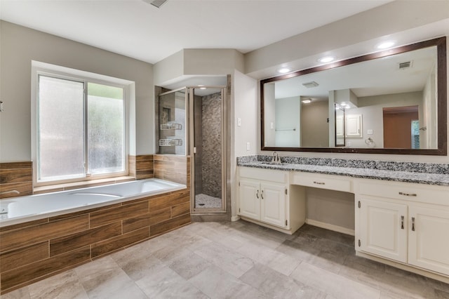 full bathroom with a shower stall, vanity, visible vents, and a bath