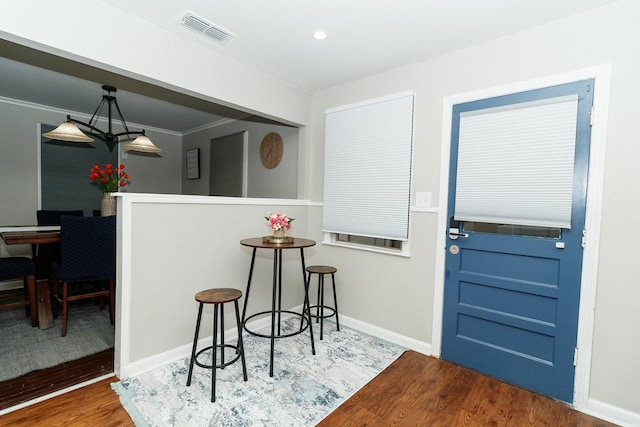 dining area featuring wood finished floors, baseboards, and recessed lighting