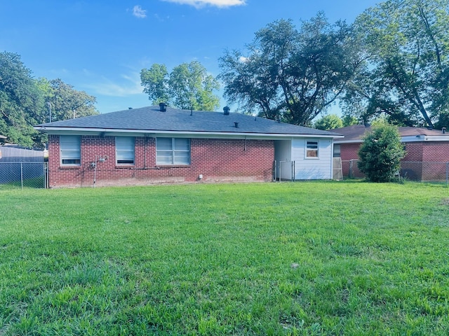 back of property featuring brick siding