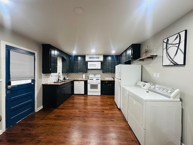 kitchen with decorative backsplash, washer and dryer, white appliances, dark wood-style floors, and a sink