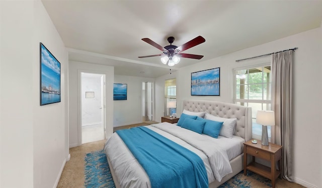 bedroom with carpet flooring, baseboards, and ceiling fan