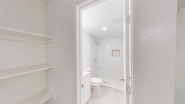 full bathroom with vanity, recessed lighting, a marble finish shower, and toilet