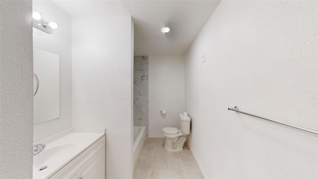 full bath featuring toilet, baseboards, a shower, and vanity