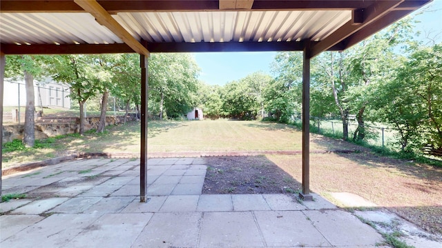 view of patio featuring fence