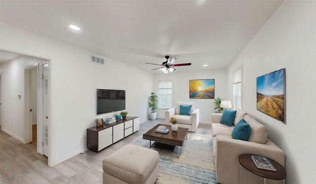 living area with ceiling fan, visible vents, baseboards, light wood finished floors, and recessed lighting
