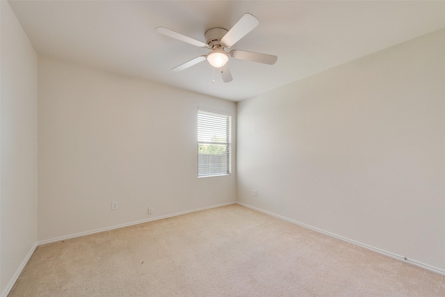 1131 Oakbrook St, Prosper, TX 75078 - empty room featuring light colored carpet, baseboards, and a ceiling fan
