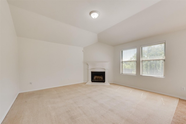 1131 Oakbrook St, Prosper, TX 75078 - unfurnished living room featuring light carpet, a fireplace with raised hearth, lofted ceiling, and baseboards